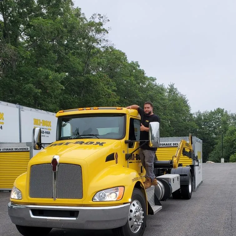 MI-BOX driver detailing a delivery truck in New Hampshire