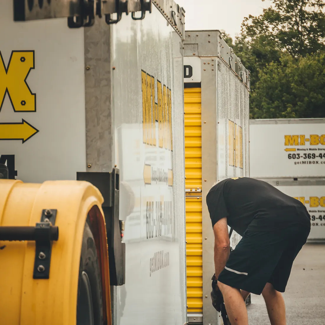 MI-BOX driver loading a portable moving and storage container in New Hampshire