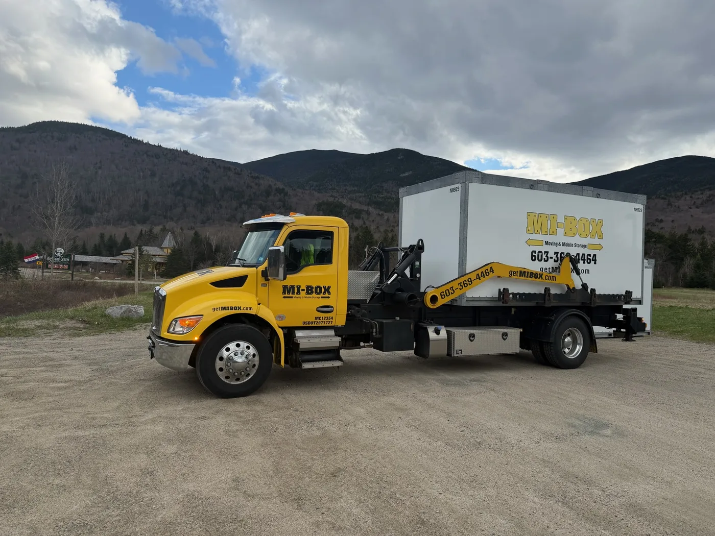 MI-BOX delivery truck on a scenic New Hampshire road