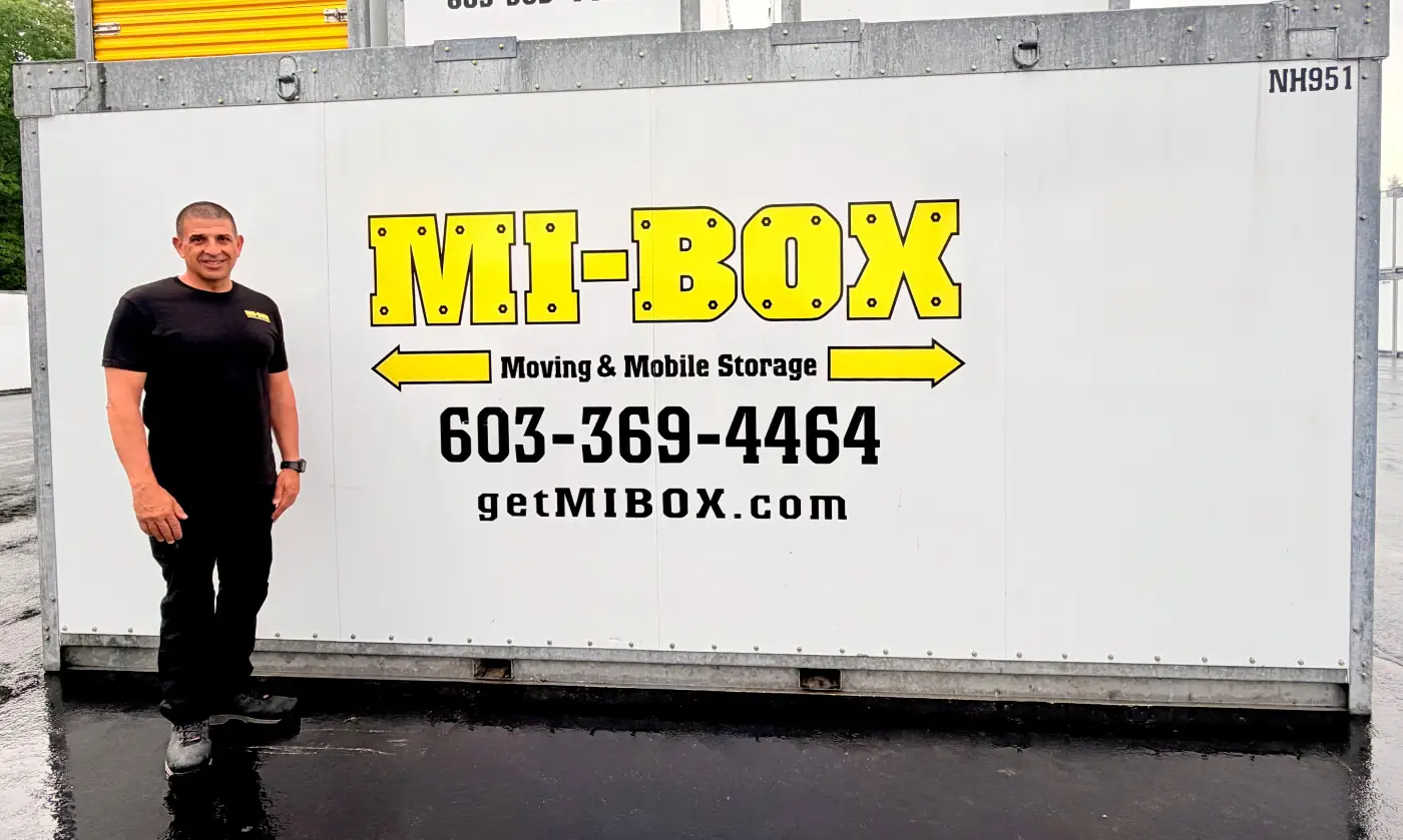 Joe Aiello of MI-BOX of Central New Hampshire standing beside a MI-BOX container